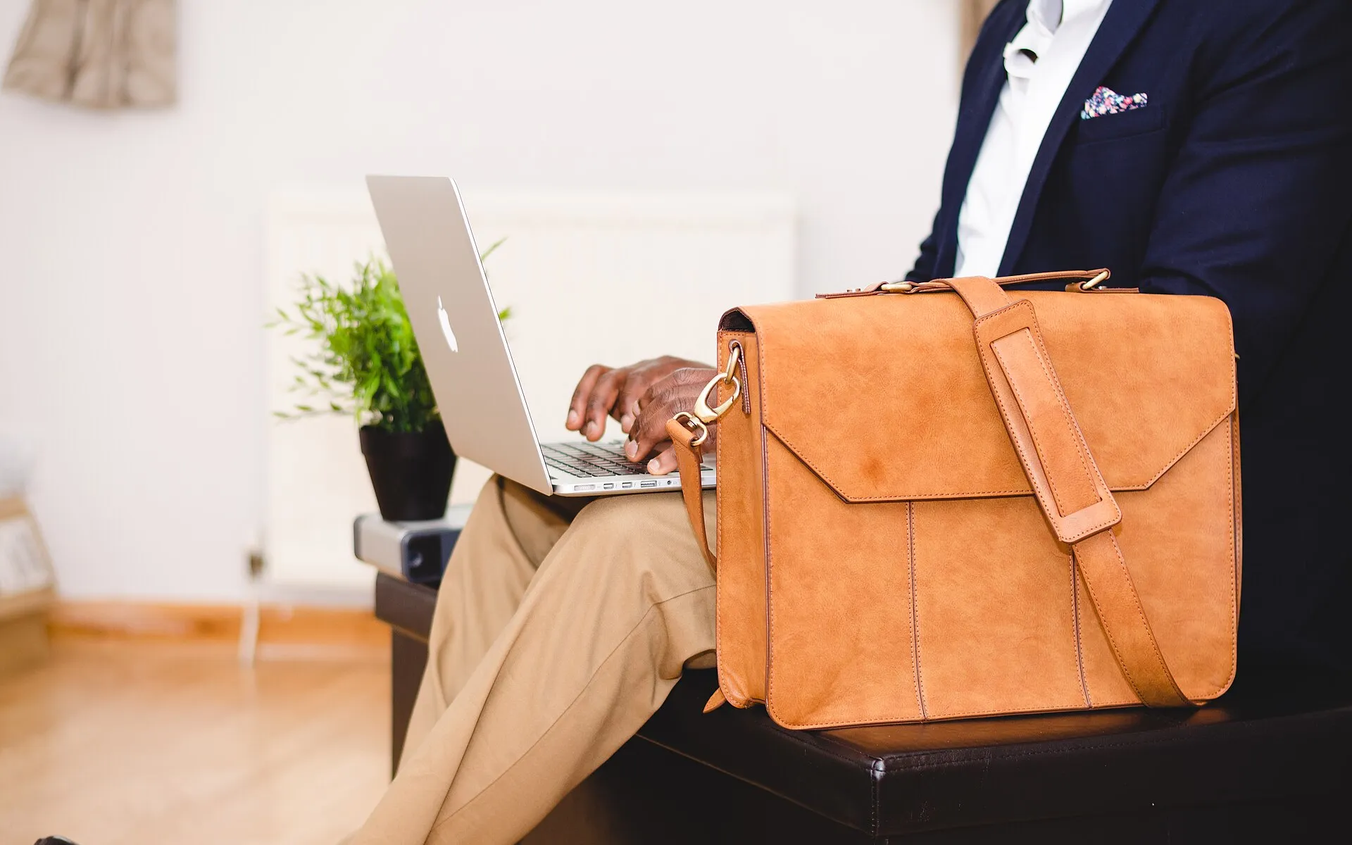 Businessman typing on a laptop