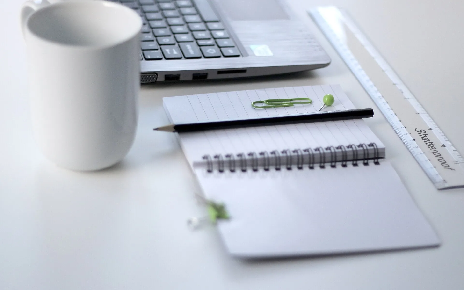 Ruler and laptop on a desk