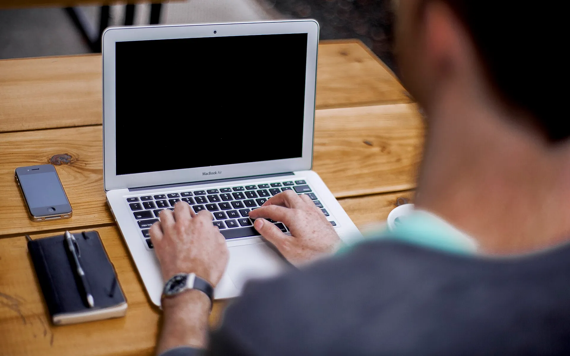 Man typing on laptop
