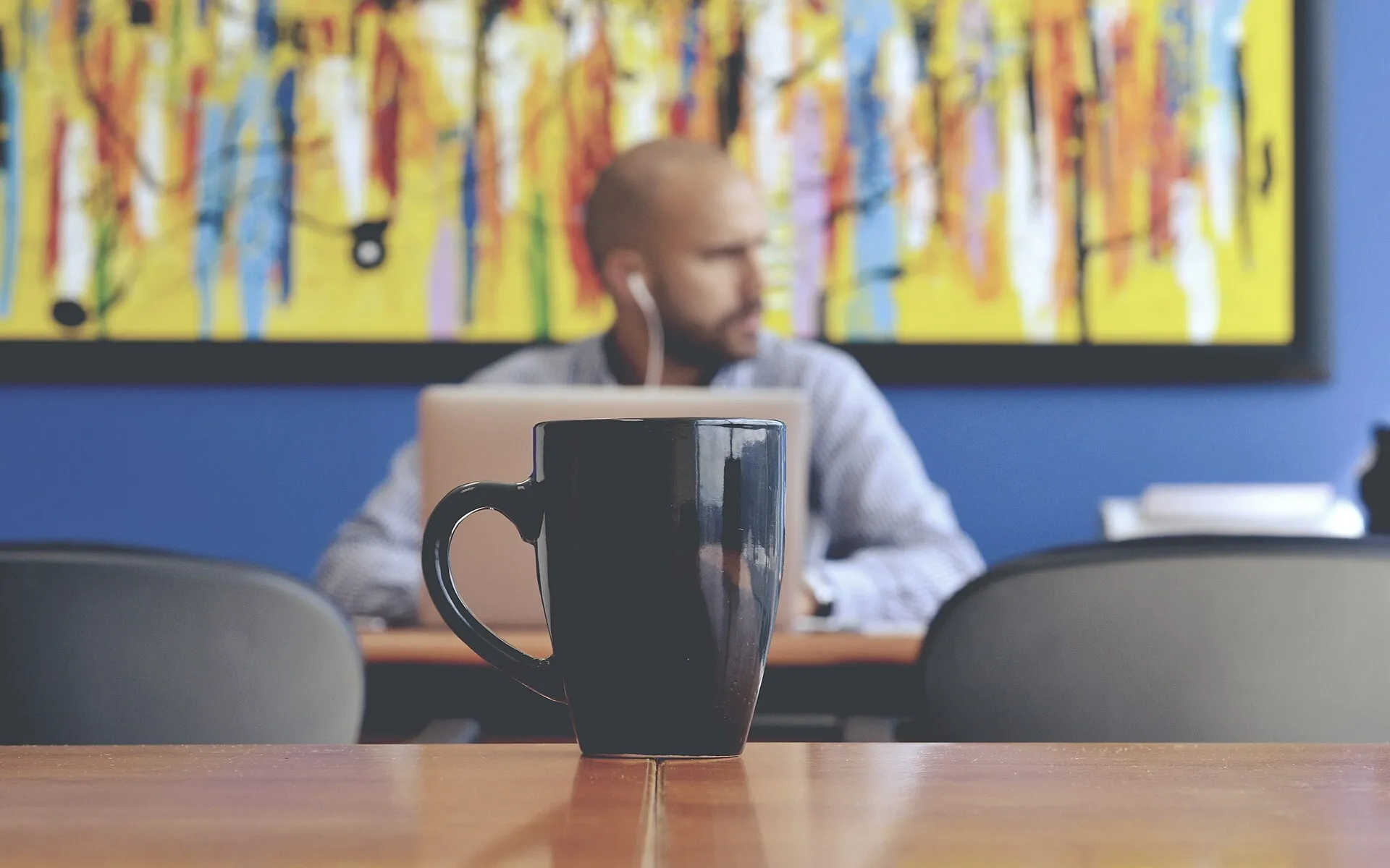 Working man behind a mug