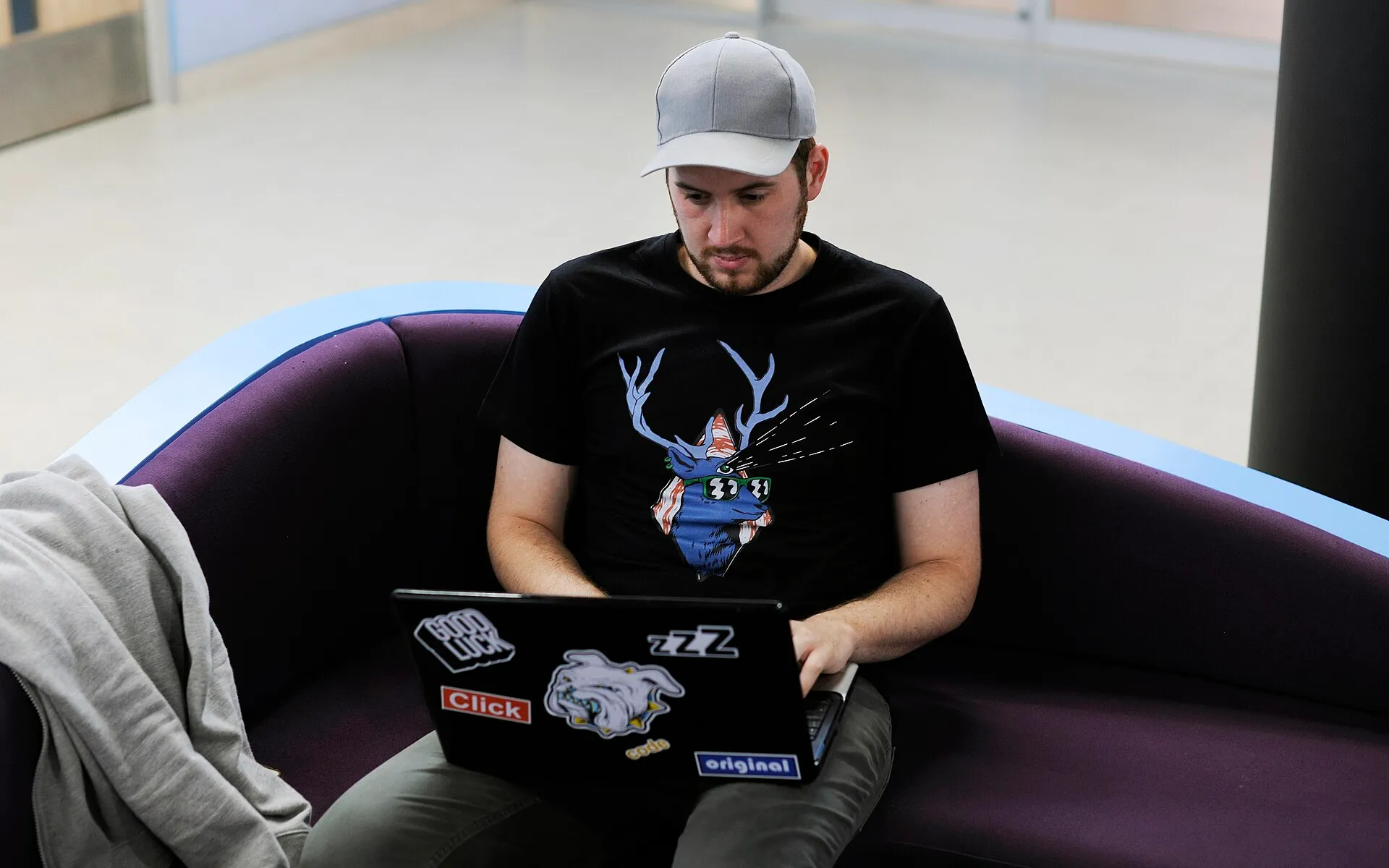 Young man working on a couch