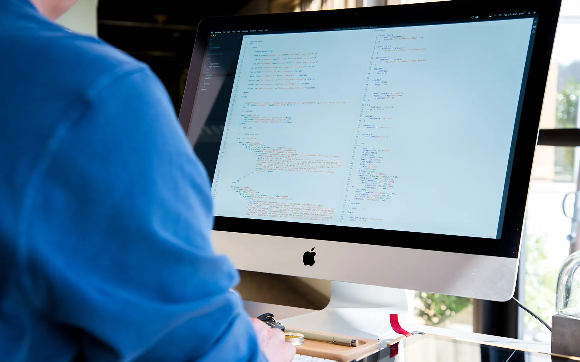 Developer working on an iMac