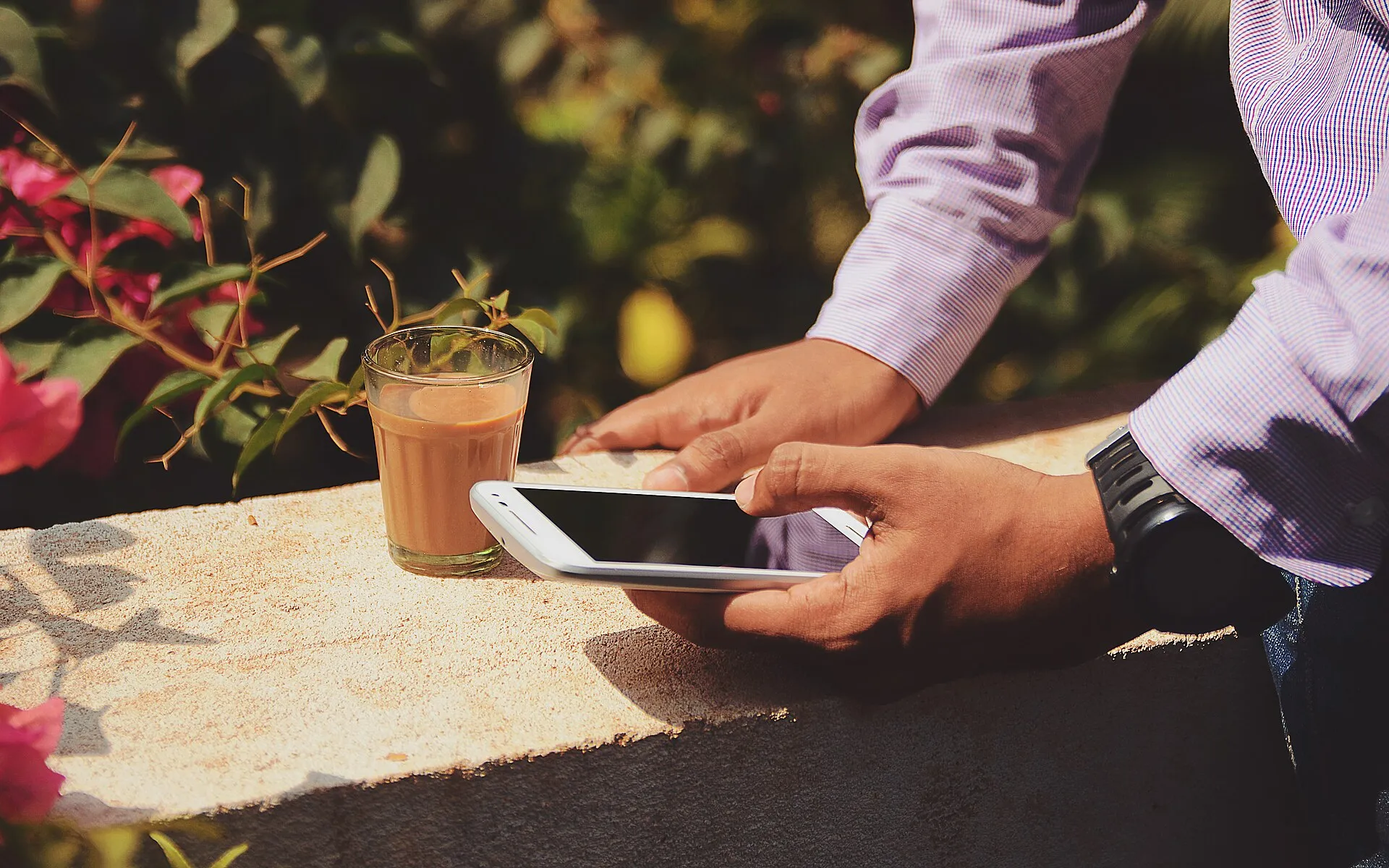 Businessman with coffee outdoors