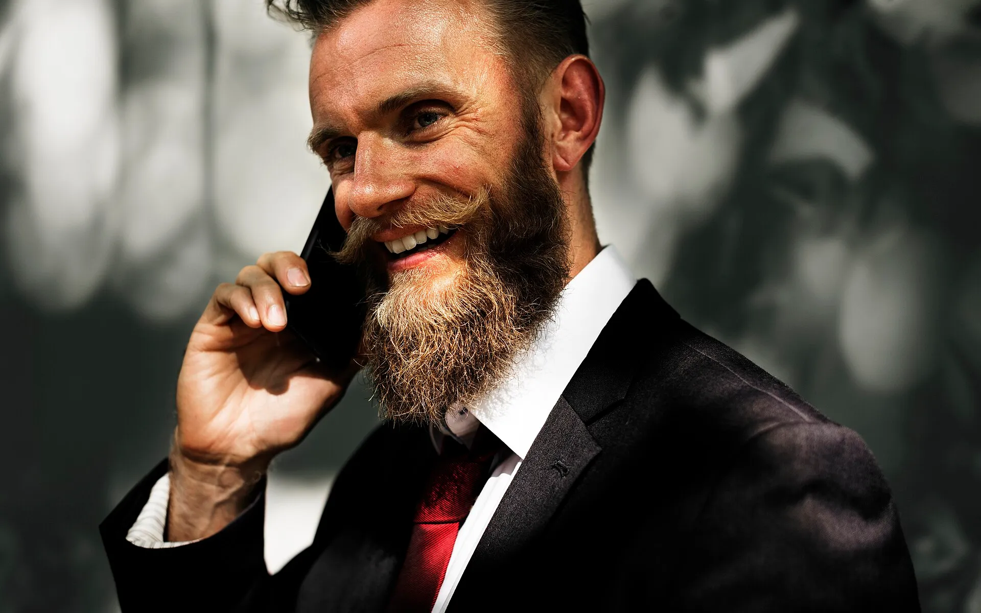 Smiling businessman on a phone