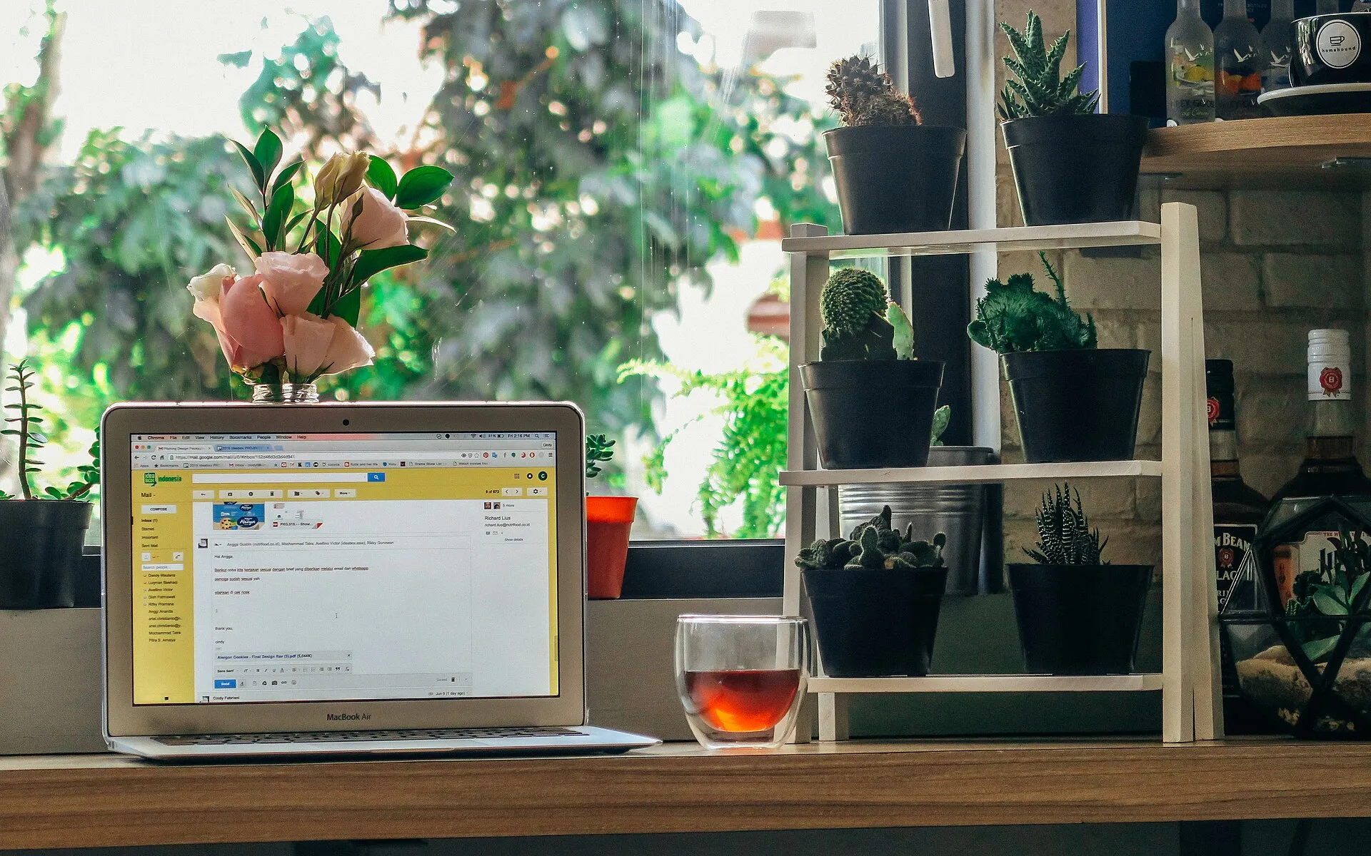 Laptop on a green thumb's desk
