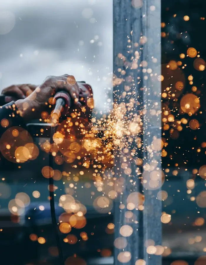 Sparks flying from metal grinding in a workshop